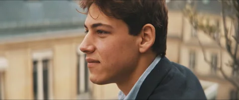 Close up of a young man smiling and staring outdoors Video stock 203586801