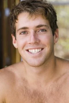 Close-up of young man smiling with cap Stock Photos