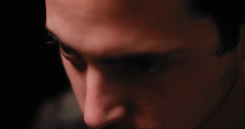 Close up of a young man smiling while getting a tattoo. BMPCC 4K Stock Footage 125764906