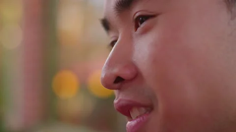 Close-up of a  young man talking to somebody Stock Footage 51780255