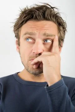 Close up of a young man thinking Stock Photos
