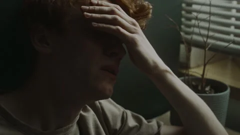 Close-up of Young Man Touching Forehead Experiencing Panic Attack Stock Footage 284246167