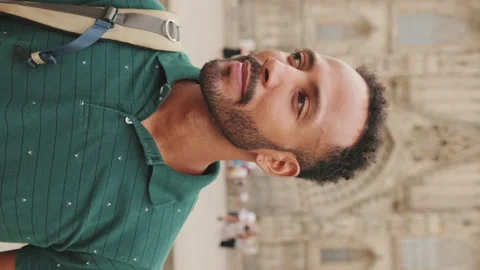 Close-up of young man tourist with backpack on his shoulder, looking at the Stock Footage 227095877
