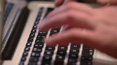 Close-up of a young man typing on a laptop keyboard Stock Footage 48223375