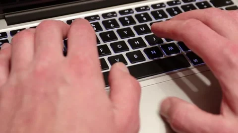 Close-up of a young man typing on a laptop keyboard Stock Footage 48223378