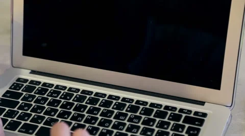 Close-up of a young man typing on a laptop keyboard Stock Footage 62802578