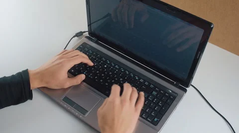 Close-up of a young man typing on a laptop keyboard Stock Footage 67989166