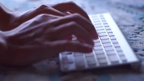 Close-up of a young man typing on a laptop keyboard Stock Footage 73099842
