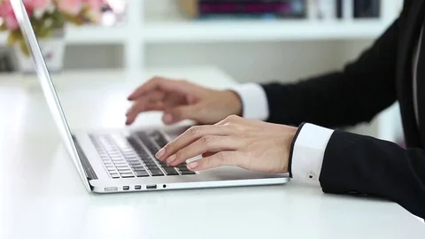 Close-up of a young man typing on a laptop keyboard Stock Footage 73614248