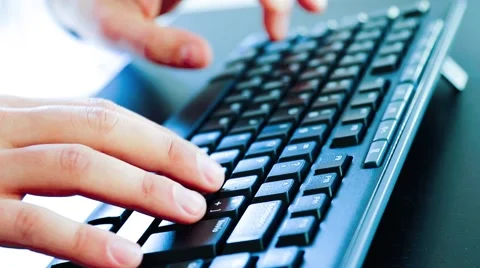 Close-up of a young man typing on a pc keyboard, technology business concept Видео 46933665