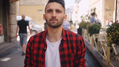 Close up young man use phone walk in city smile feel happy surprised blurred Stock Footage 92069790