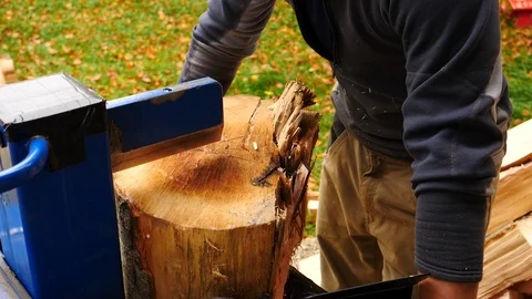 Close up of young man using hydraulic press machine for cutting wood 動画素材 96003889
