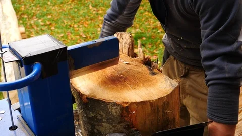 Close up of young man using hydraulic press machine for cutting wood 動画素材 96004758