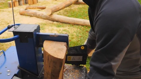 Close up of young man using hydraulic press machine for cutting wood 動画素材 96006184