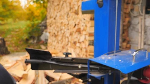 Close up of young man using hydraulic press machine for cutting wood 動画素材 96006525