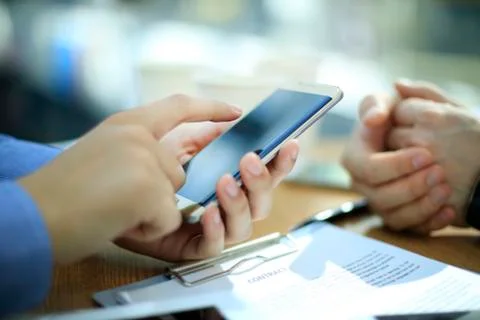 Close up of a young man using mobile smart phone Stock Photos