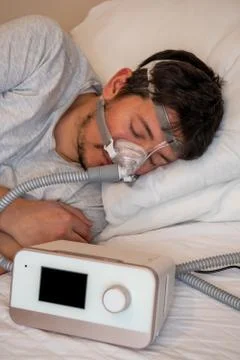 Close-up of young man using respirator machine for breathing Stock Photos