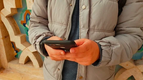 Close-up of a young man using a smart phone outdoor Stock Footage 98408350