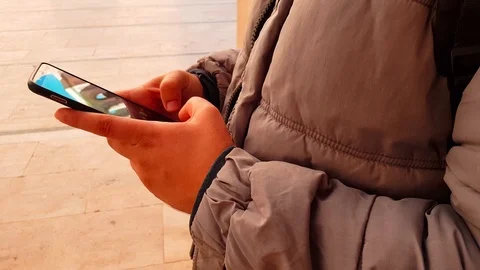 Close-up of a young man using a smart phone outdoor 스톡 동영상 98409549