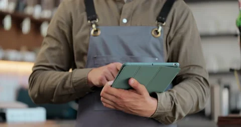 Close up of young man waitress using digital tablet at counter and taking orders Stock Footage 159559797