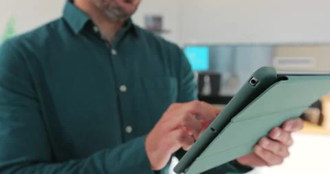 Close up of young man waitress using digital tablet at counter and taking orders Video stock 203892125