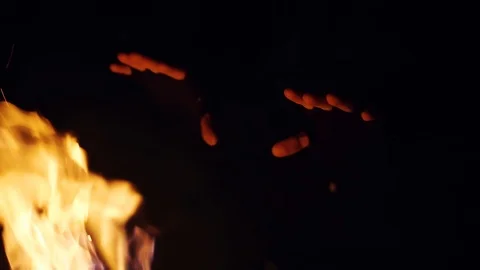 Close up young man warm hands an open fireplace outdoor at night happy in winter Stock Footage 105204995