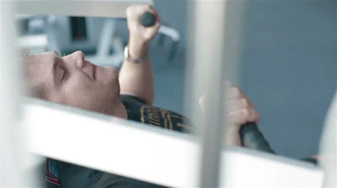 Close-up a young man working out in a gym. Side view Stock Footage 49162278