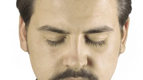 Close up of young man's eyes opening. White clean background Stock Footage 76203726