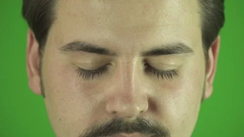 Close up of young man's eyes opening and smiling slow motion. Greenbox Stock Footage 76203757