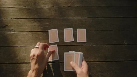 Close up of a young man's hand as he paying cards. Young croupier shuffles a Stock Footage 245228968