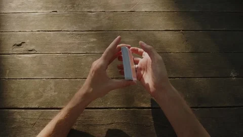 Close up of a young man's hand as he paying cards. Young croupier shuffles a Stock Footage 245228987