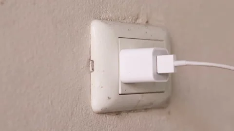 Close up young man's hand held the plug into the outlet And unplug after use, Stock Footage 143894329