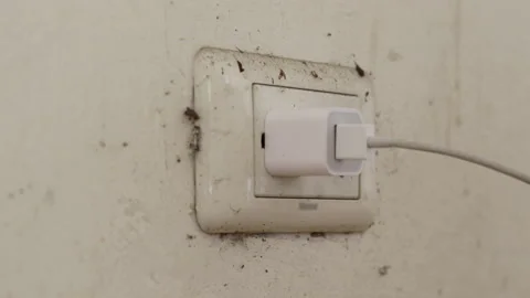 Close up young man's hand held the plug into the outlet And unplug after use, Stock Footage 143894333