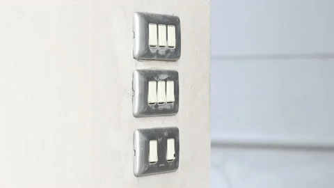 Close up young man's hand pressed the button to turn on the light switch, Ope Stock Footage 143894449