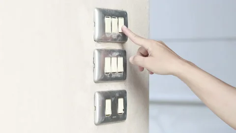 Close up young man's hand pressed the button to turn on the light switch, Ope Stock Footage 143894501