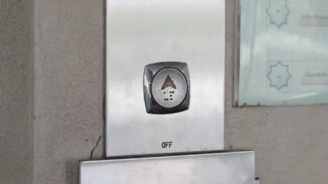 Close up young man's hand pressed the button for the elevator in office or ho Stock Footage 143894559