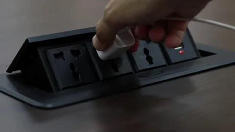 Close up young man's hand pressing button, Man's hand held the plug into the Stock Footage 143894480