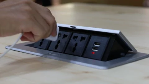 Close up young man's hand pressing button, Man's hand held the plug into the Stock Footage 143894588