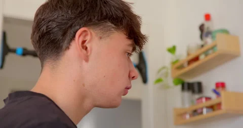 Close-up of a young man's profile: Stock Footage 336141840