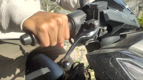 A Close-up of A Young Man’s Right Hand Gripping The Motorcycle’s Throttle Video stock 332383387