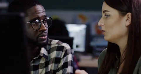 Close up of young mixed races couple of coworkers creating a business sturtup at Stock Footage 82447462