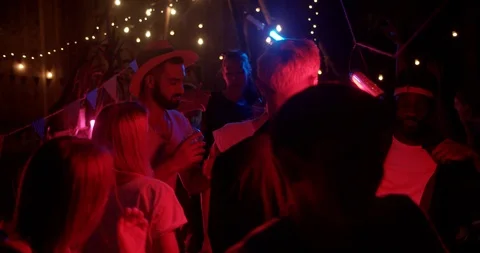 Close up young multi-ethnic people during dancing colorful party in different Stock Footage 115392879