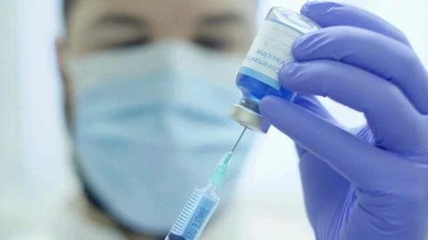 Close up young nurse preparing injection with syringe in hospital a medical Stock-Footage 336587098