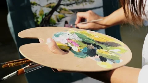 Close up of an young painter hands that paints on the textile. Stock Footage 138624089