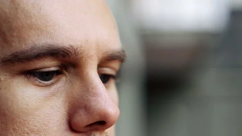 Close up on young pensive man  looking away lost in his thoughts Stockbeeldmateriaal 135425658