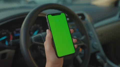 Close-up of young person using modern vertical smartphone greenscreen showing Stock Footage 117549018