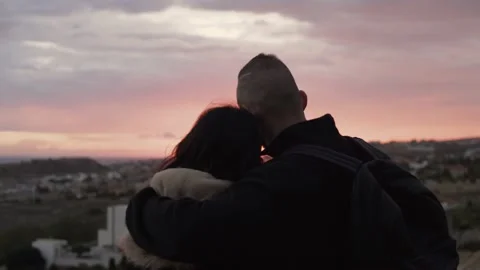 Close-up of young romantic couple looking at skyline and hugging Video stock 149392596