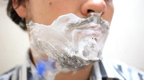 Close-up of young shaving man. HD. 1920x1080 Stock-Footage 43239309