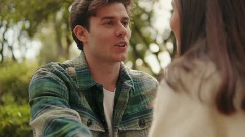 Close-up of young smiling man looking at his girlfriend Stock Footage 317945227