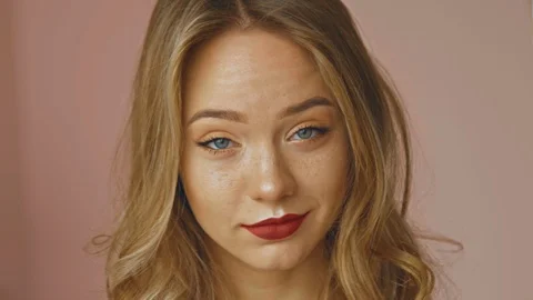 Close up of a young stressed fair-haired girl isolated over pastel background Stock Footage 111158619